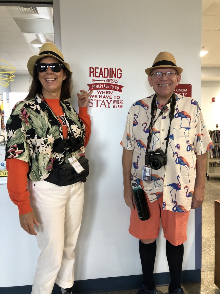 Mrs. Parrilli and Mr. Boring as tourists because reading takes you  places.