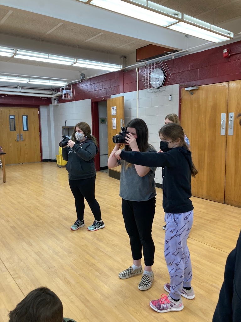 Yearbook Club members - practicing with digital cameras