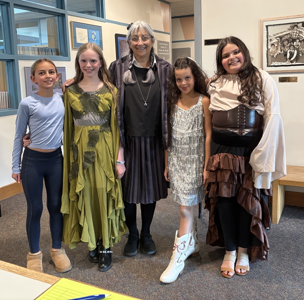 4 Upper El rilds with Mrs. Muffoletto on Halloween in costume