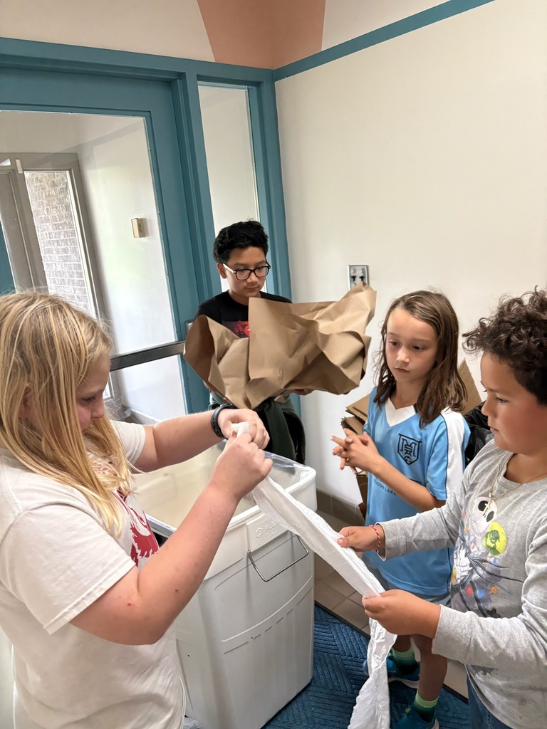 UE and LE students collecting recycling.