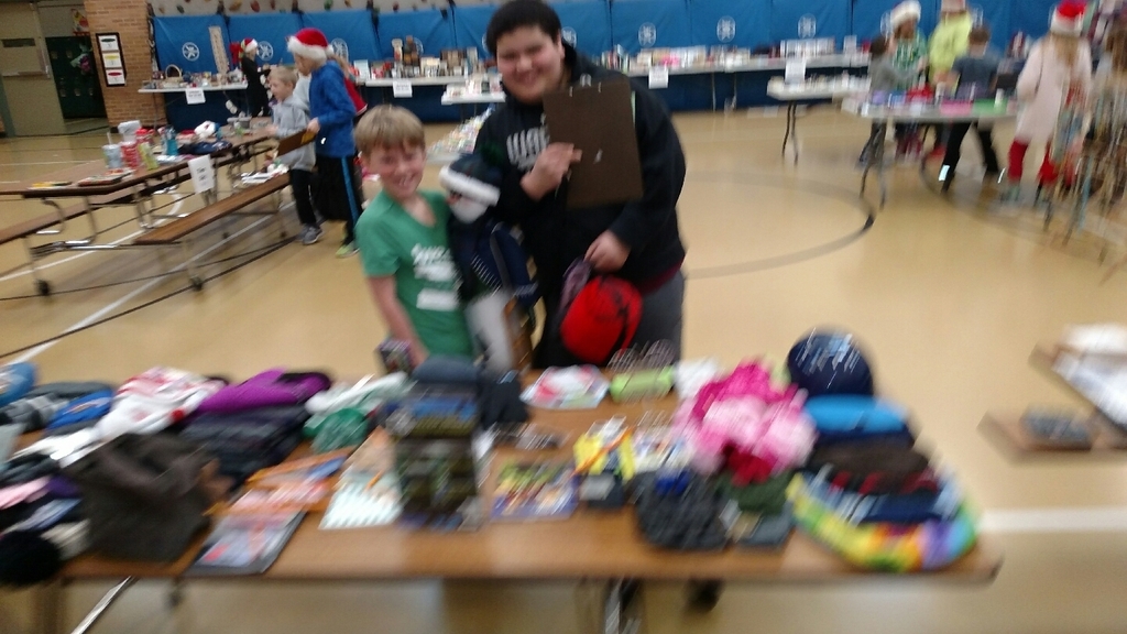 K-2 students participate in the Holiday Sale with 6th grade elf's.