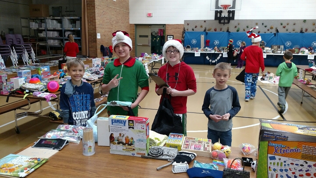 K-2 students participate in the Holiday Sale with 6th grade elf's.