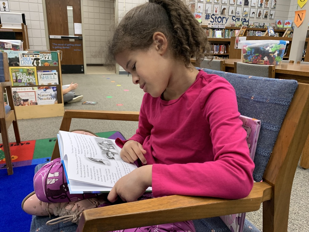 2nd graders enjoy "read to self" time after checking out their books in the library. Giving lots of ample reading time helps to grow readers!   #CPSZEBRAPRIDE
