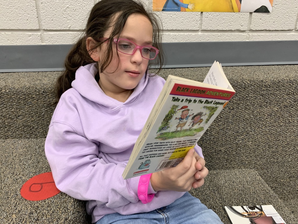 2nd graders enjoy "read to self" time after checking out their books in the library. Giving lots of ample reading time helps to grow readers!   #CPSZEBRAPRIDE