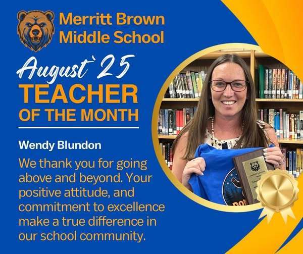 Mrs. Blundon holding her plaque and tshirt