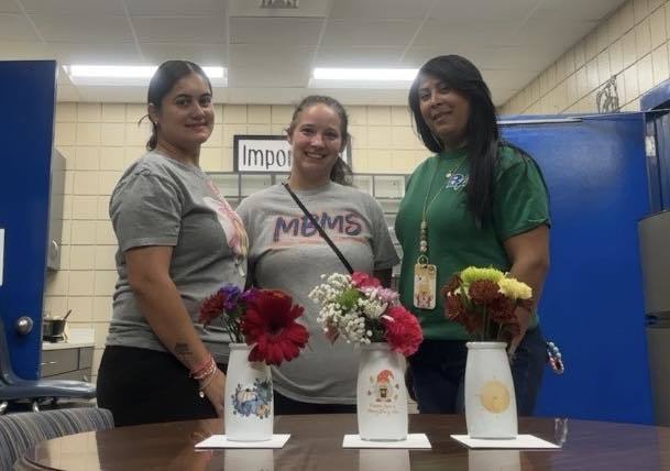 custodians with flowers