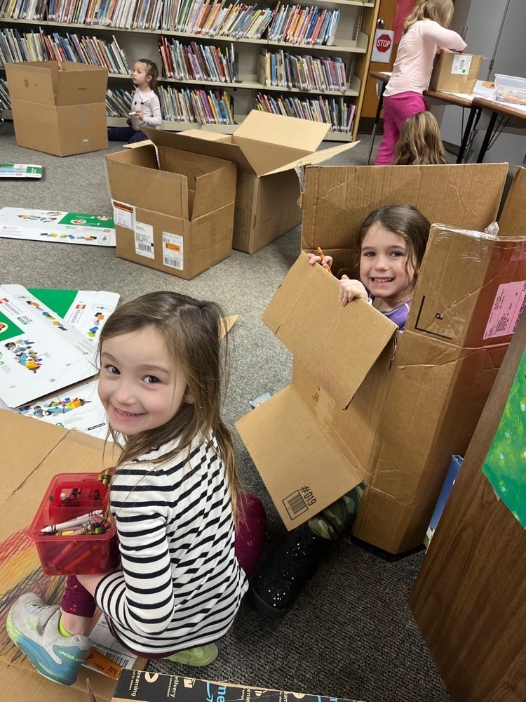 k student building with a box 