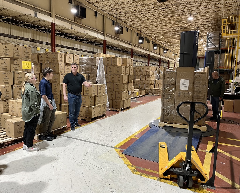 two kids standing with and adult