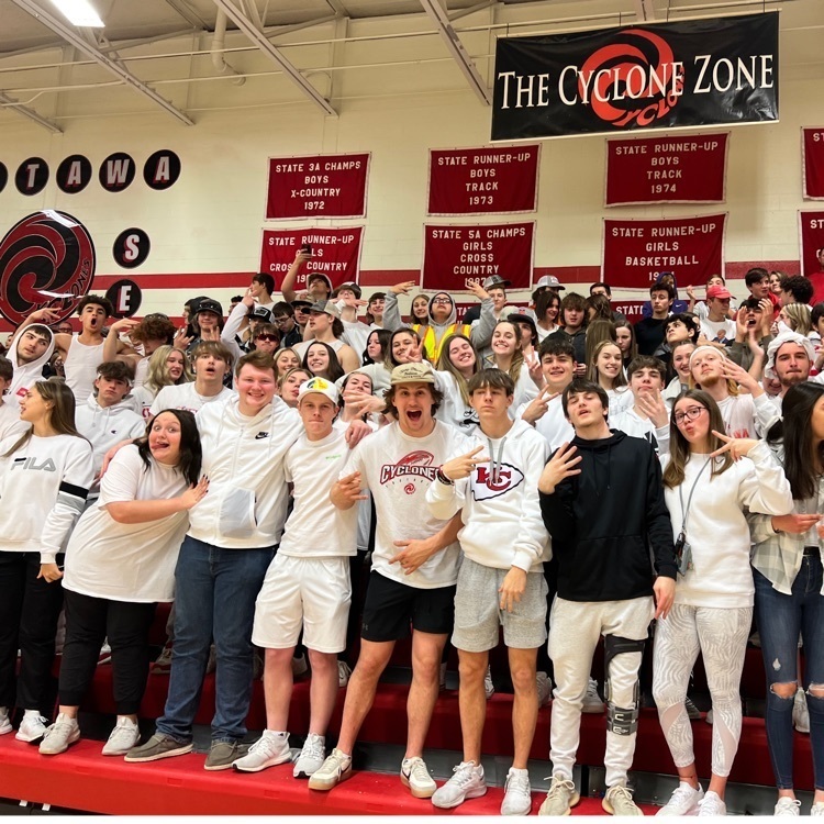 students standing in bleachers