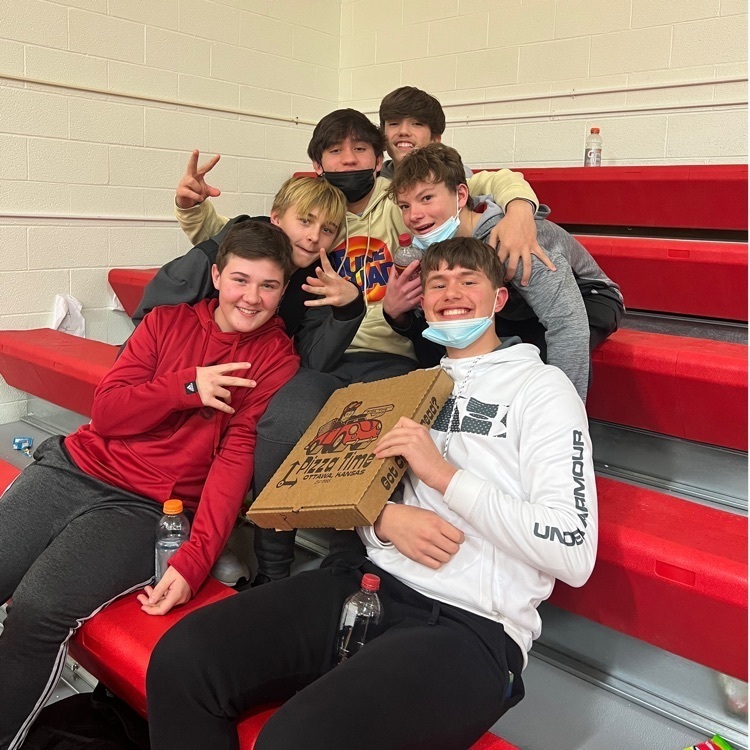 kids posing with pizza