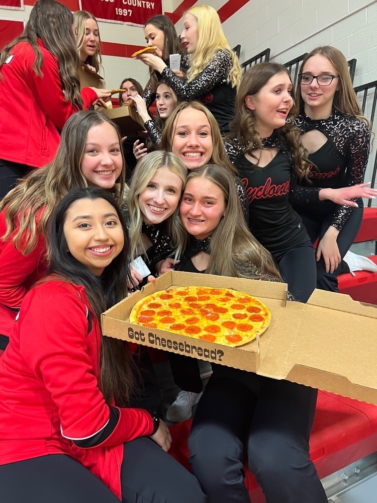 posing with a pizza