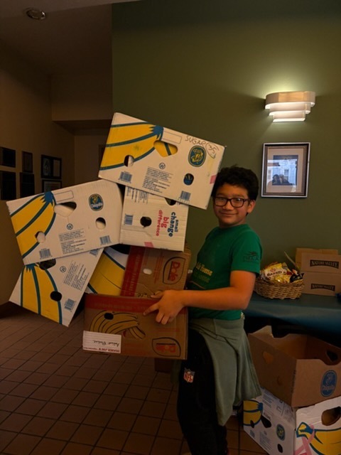 boy with 6 banana boxes