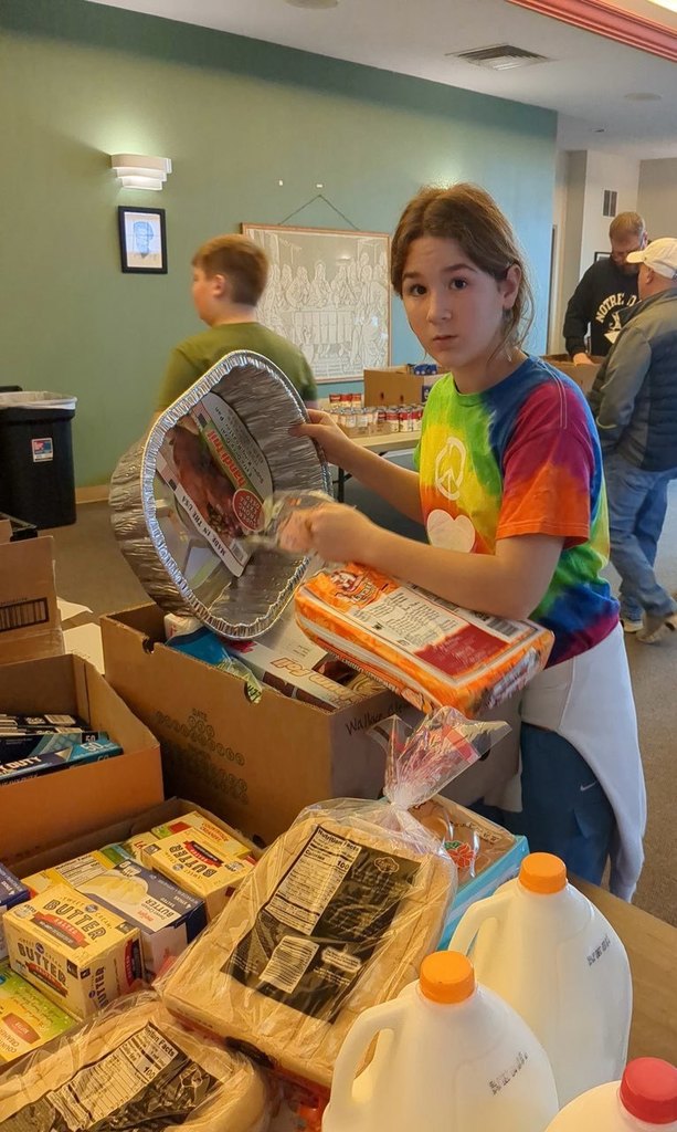 Girl putting food into a box