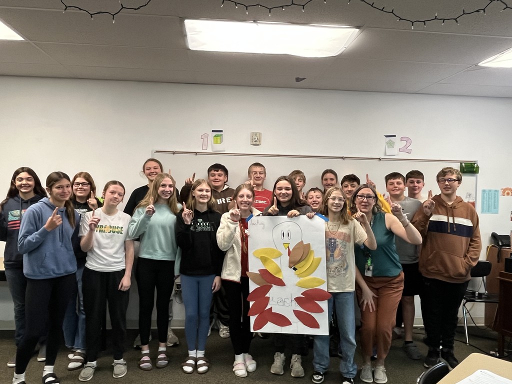 Group of students holding a poster of a turkey