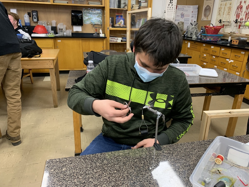 Student tying a fishing fly 