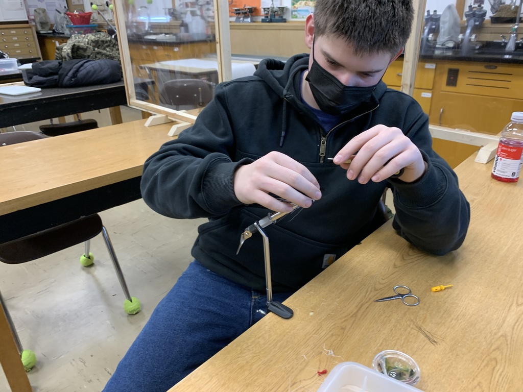 Student tying a fishing fly 