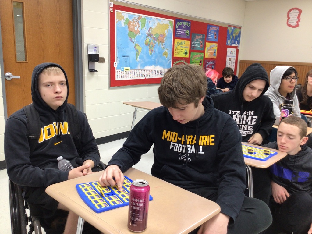 Students playing Guess Who