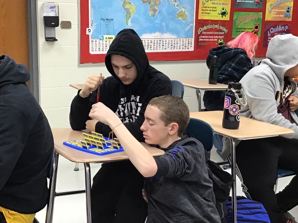 Students playing Guess Who