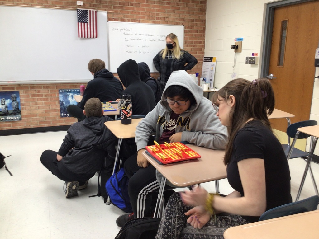 Students playing Guess Who