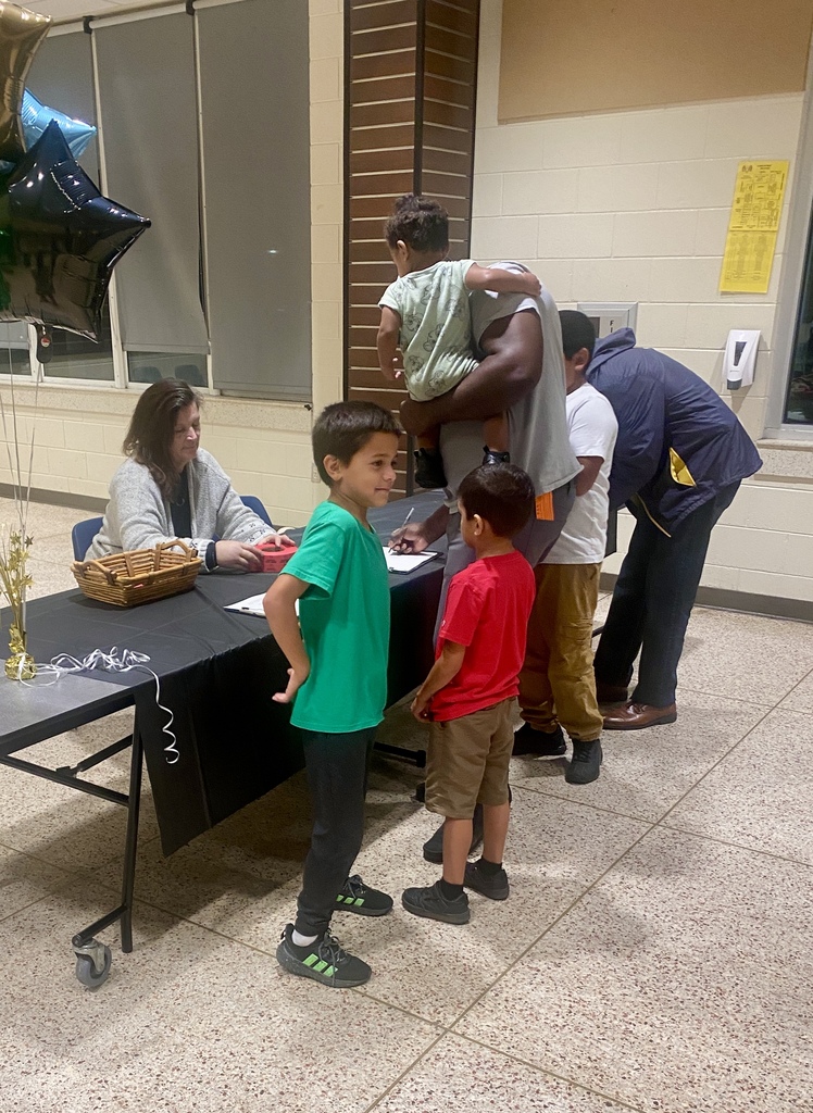 Dads and their children sign in for the Rutherford All Pro Dad Spaghetti Supper