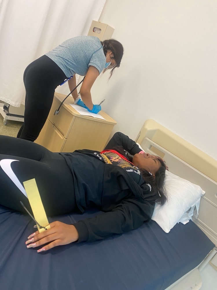EMT students performing assessments