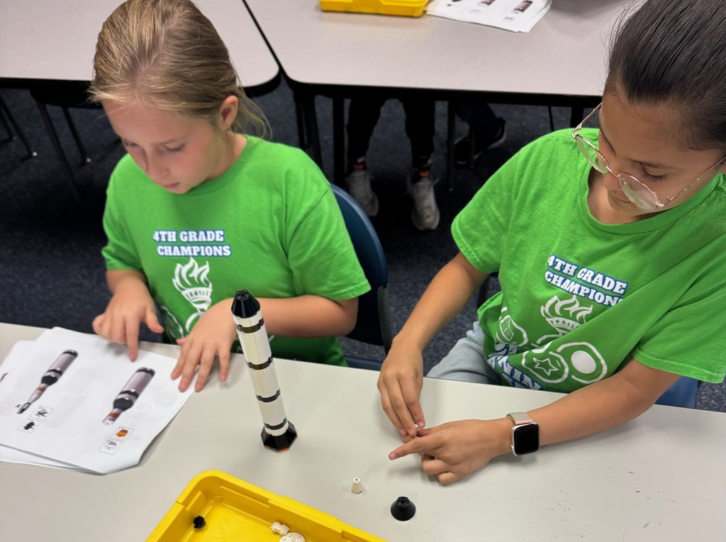 Students build model rockets.
