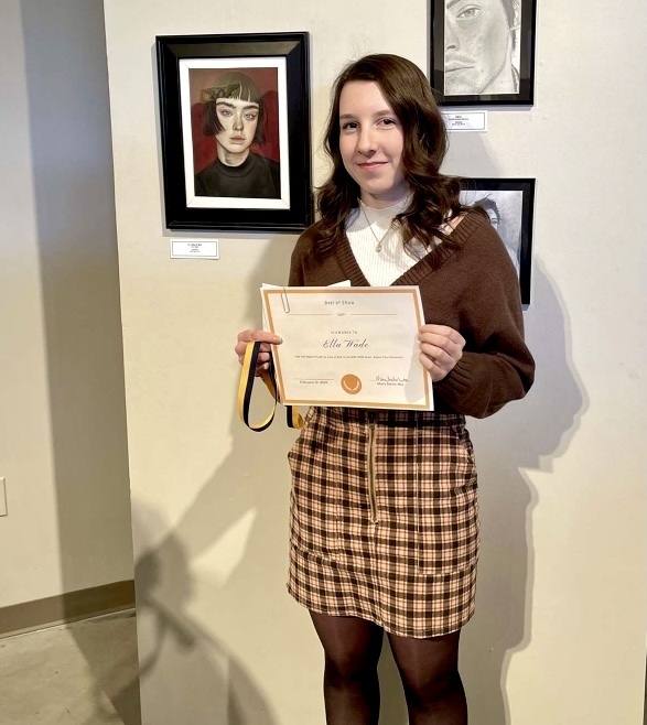 Ella Wade with award and artwork