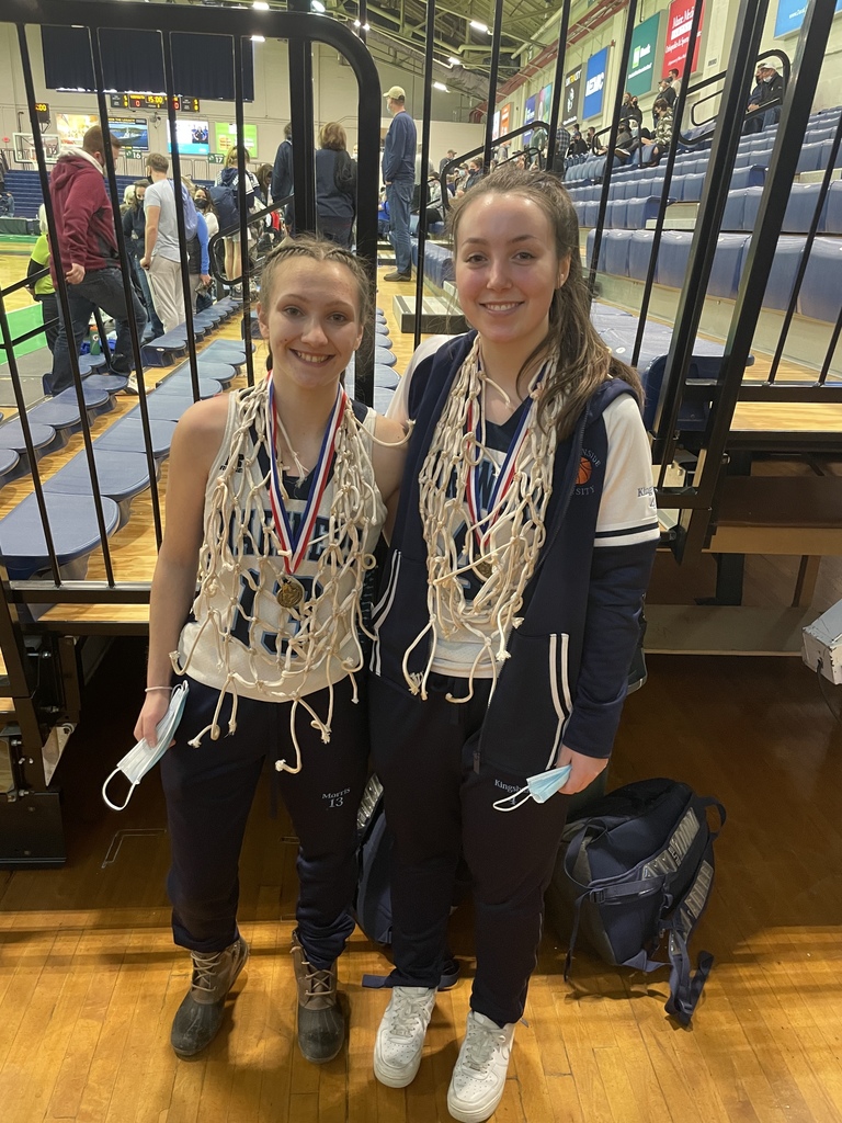 two basketball players celebrate victory 