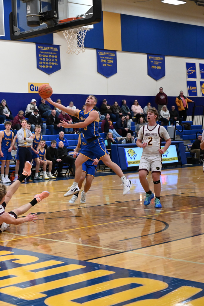 Karson driving into the basket to score his 1000th point.