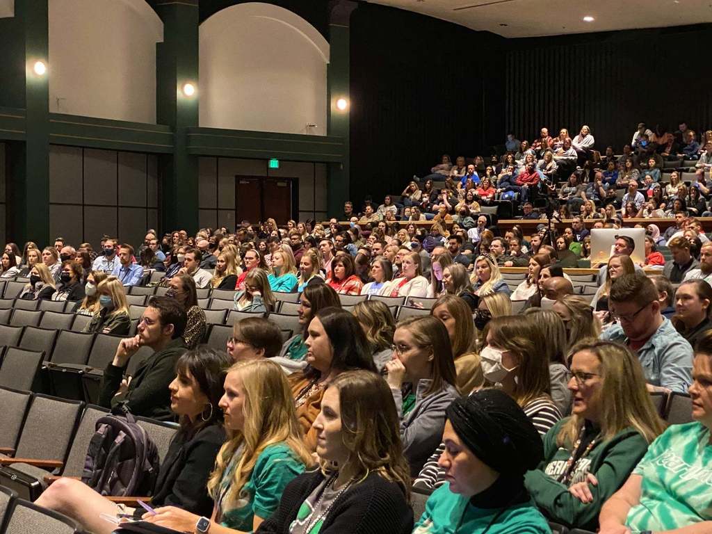 people sitting in an auditorium