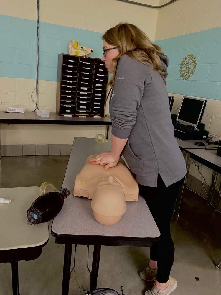 students performing CPR