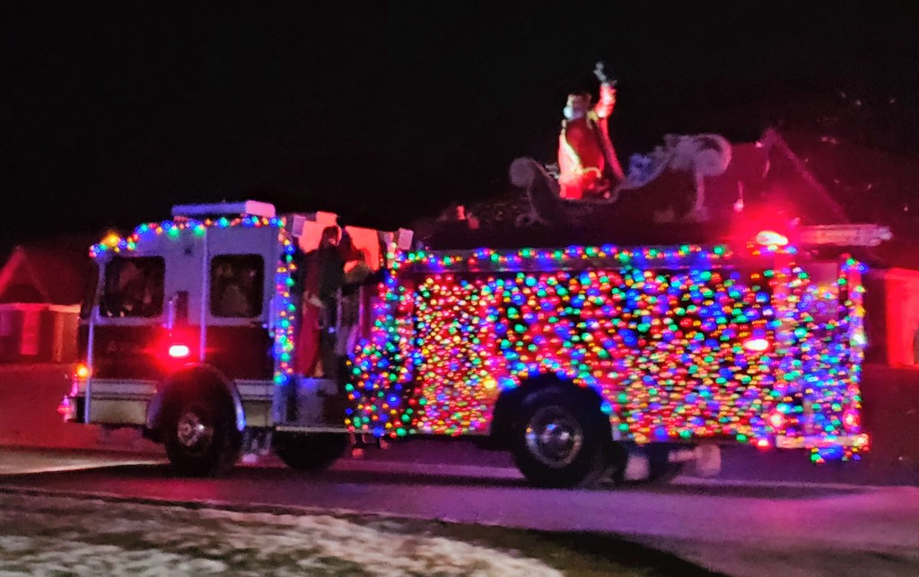 firetruck with lights and Santa