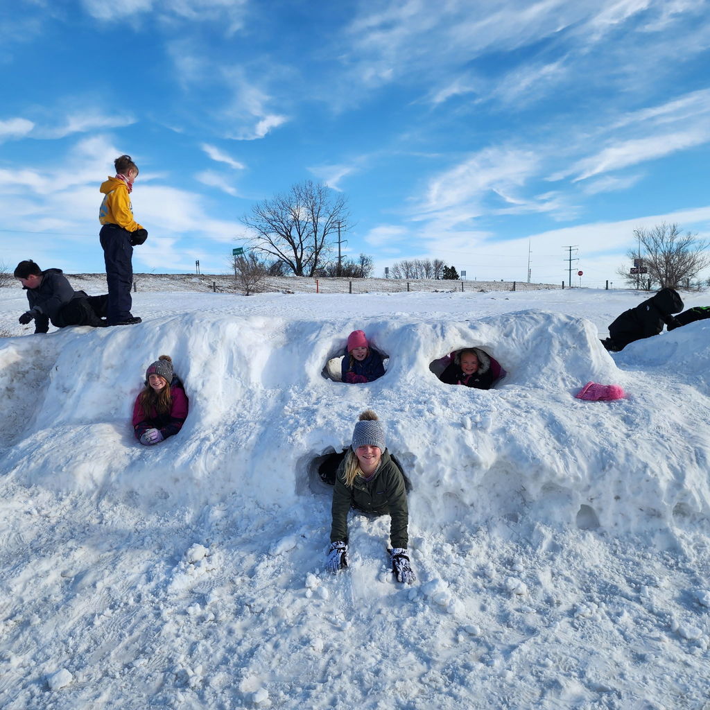 Kids on a snow pile