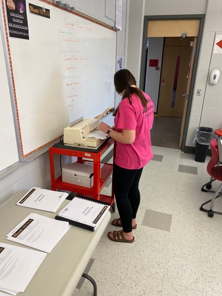 students working on books 