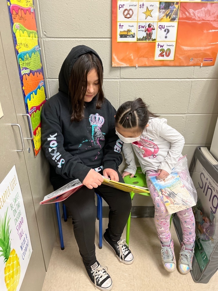 These readers partnered up and checked out a good book together!