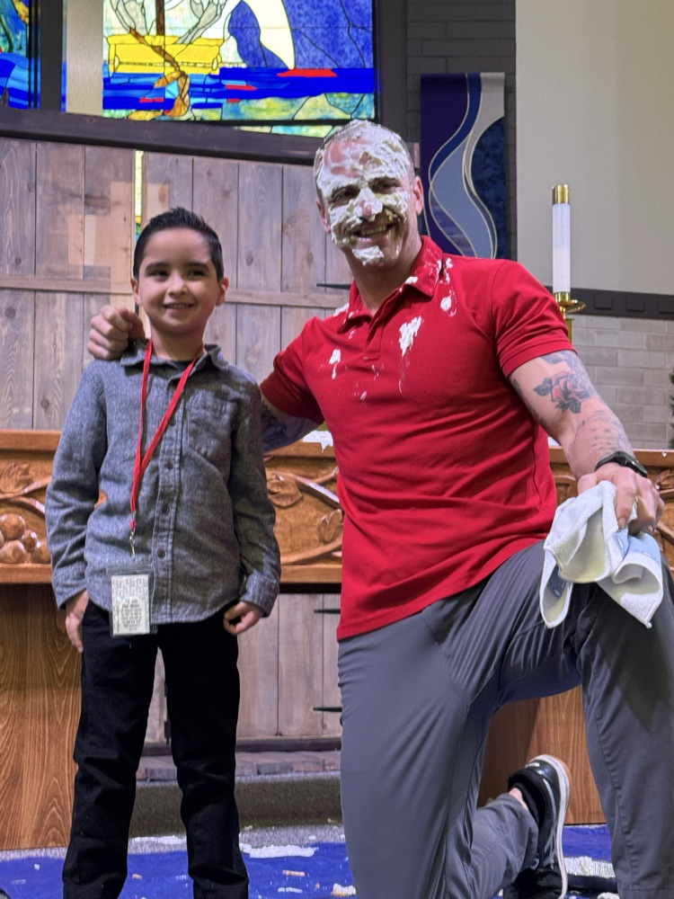 Leo smashing a pie on n Me. Garrett’s face.