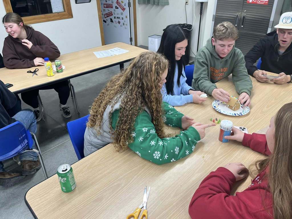 Students building gingerbread houses