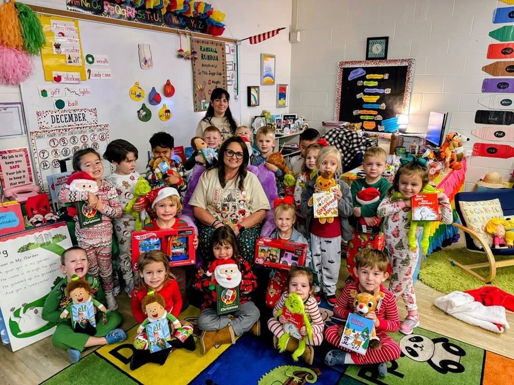 students and teacher with Christmas gifts