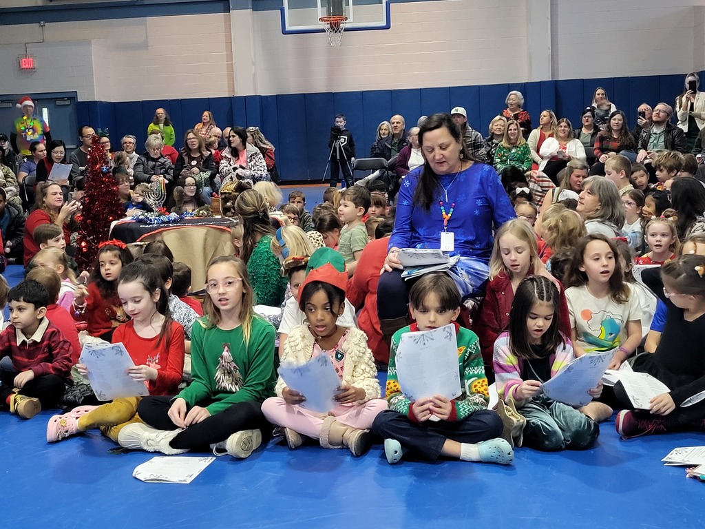 Children and teacher singing 