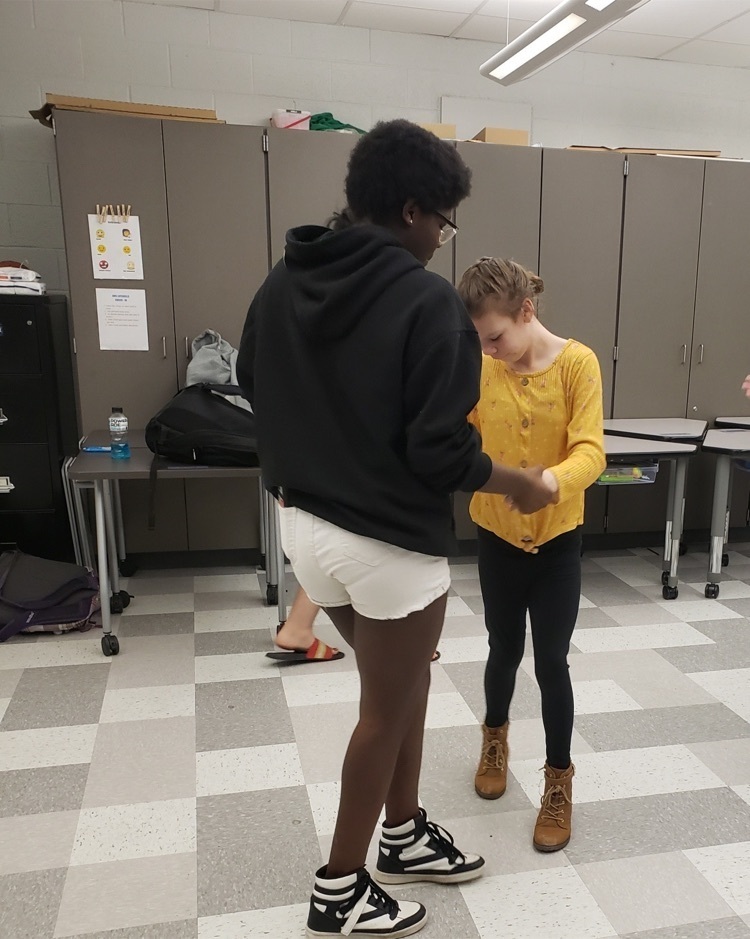 two students dancing 