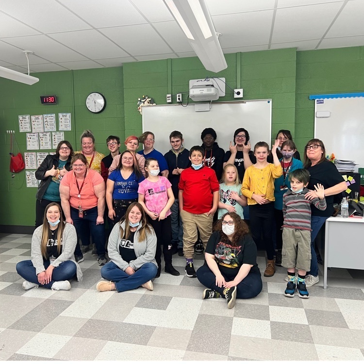 students and adults posing 