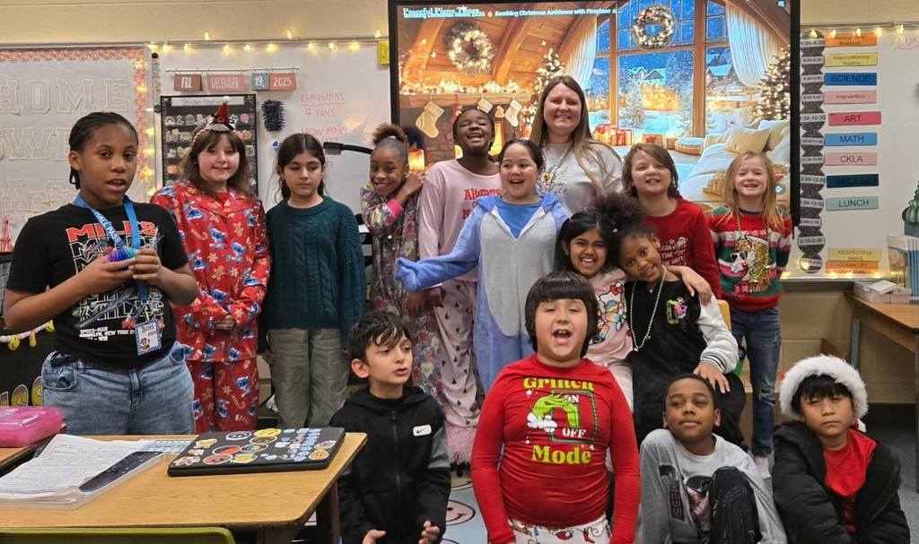 A group of students smiling, in festive clothing.