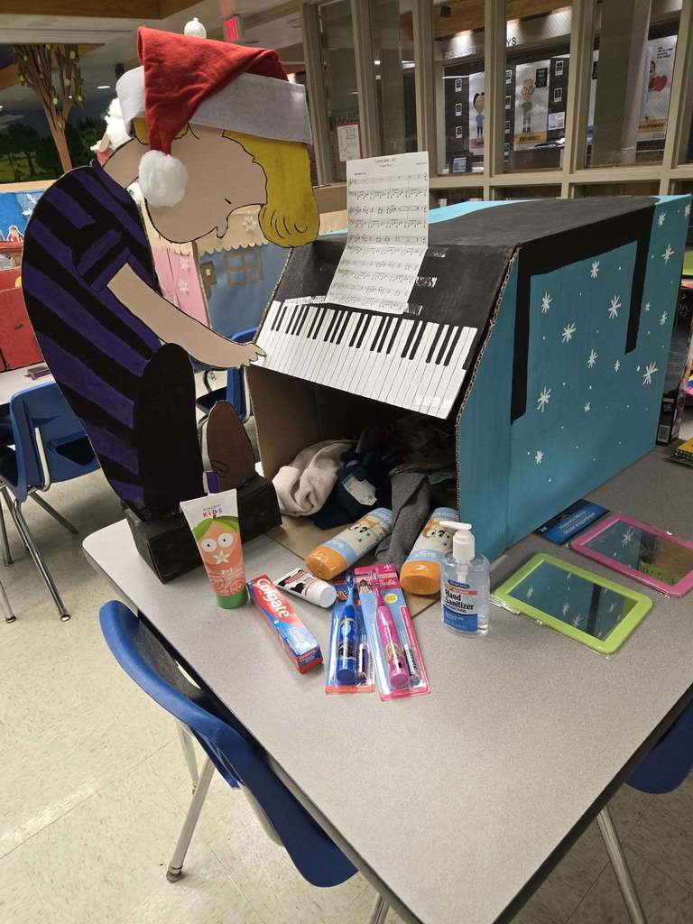 A Charlie Brown Christmas inspired box and hygiene products spilling out of it.
