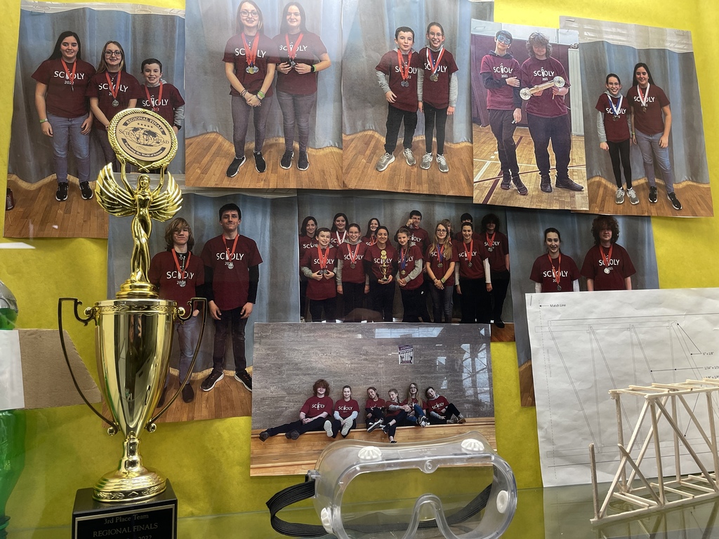 Image of a display case with a trophy and goggles