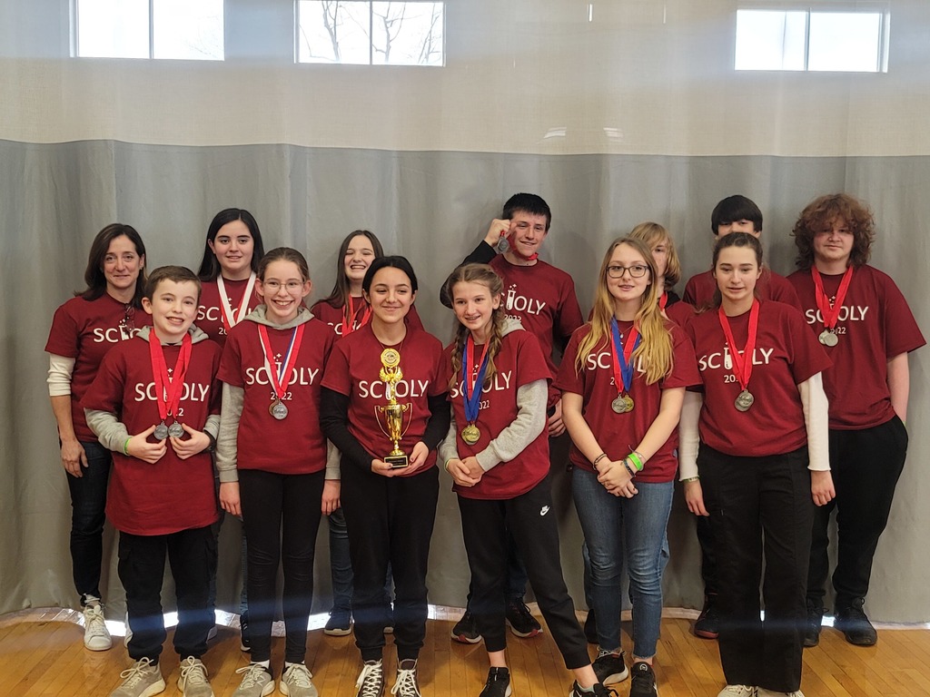 Images of students with red shirts wearing medals.