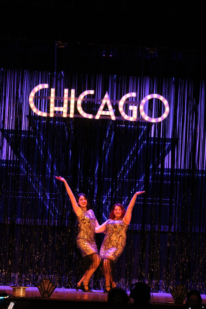 Two students stand under the name Chicago