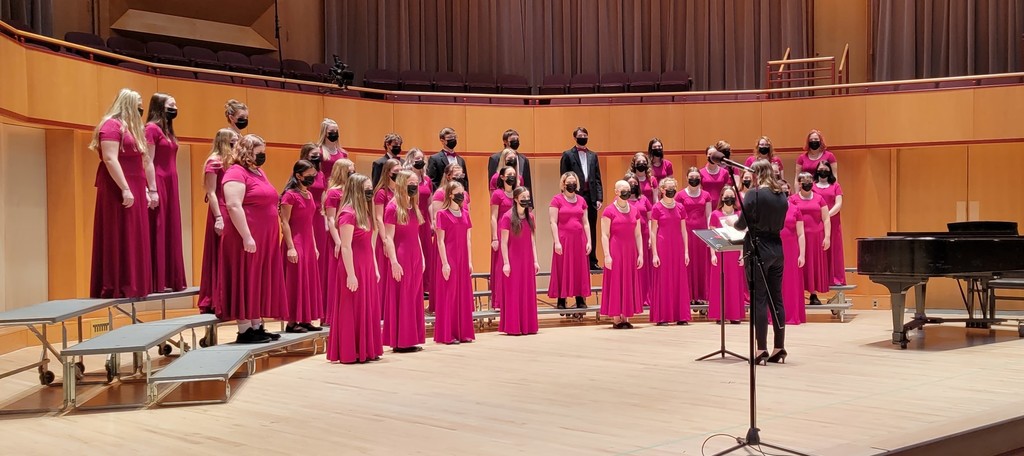 choir standing with dresses and tux