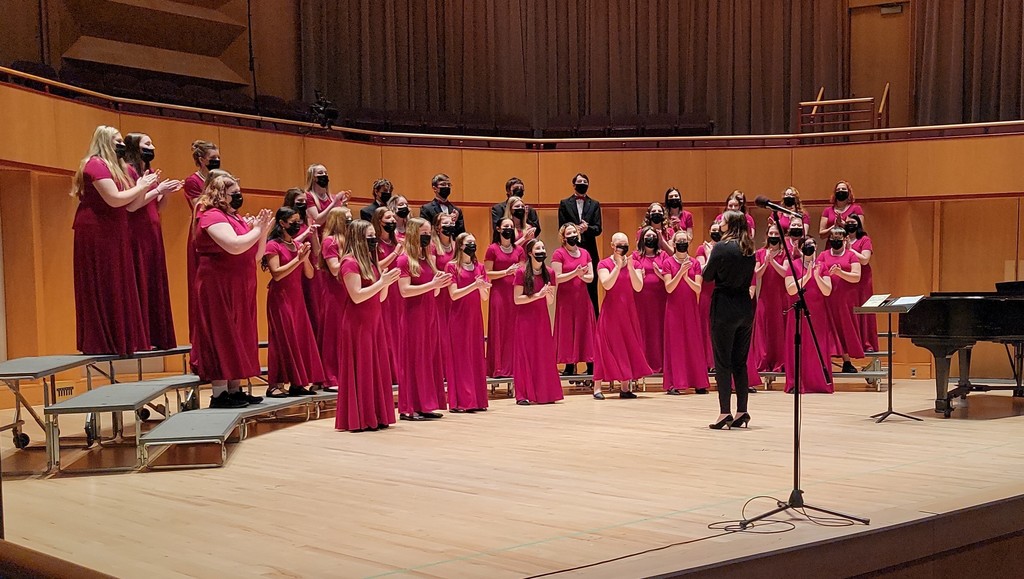 choir standing and clapping