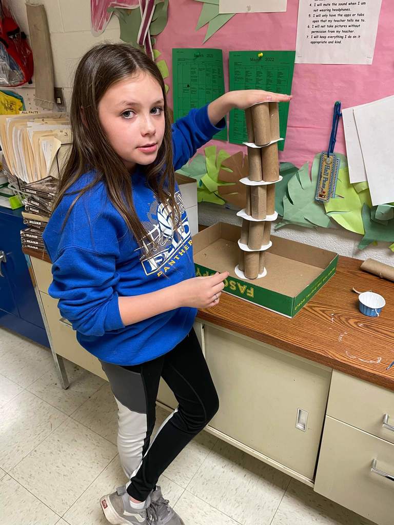 Students posing with and working on their Leaning Tower of Pisa projects