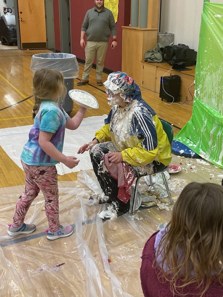 A pie in Ms. Martin's face